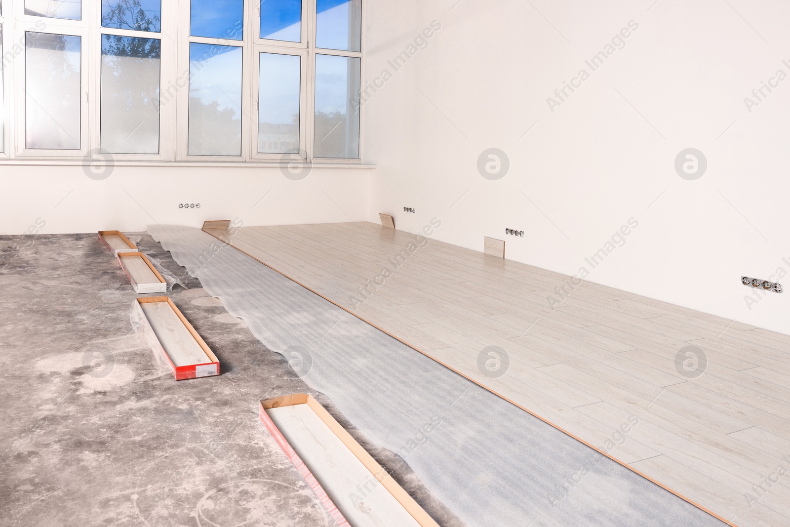 Photo of Light spacious room with unfinished laminate flooring