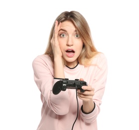 Emotional young woman playing video games with controller isolated on white