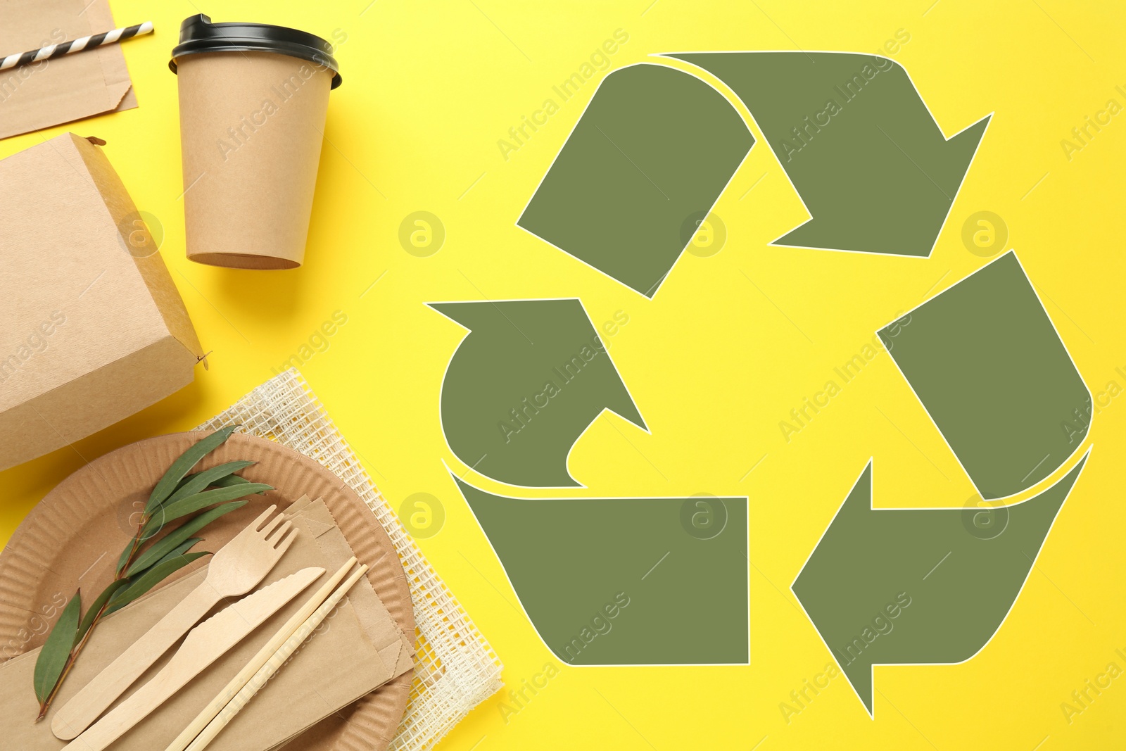 Image of Flat lay composition with eco friendly tableware and recycling symbol on yellow background