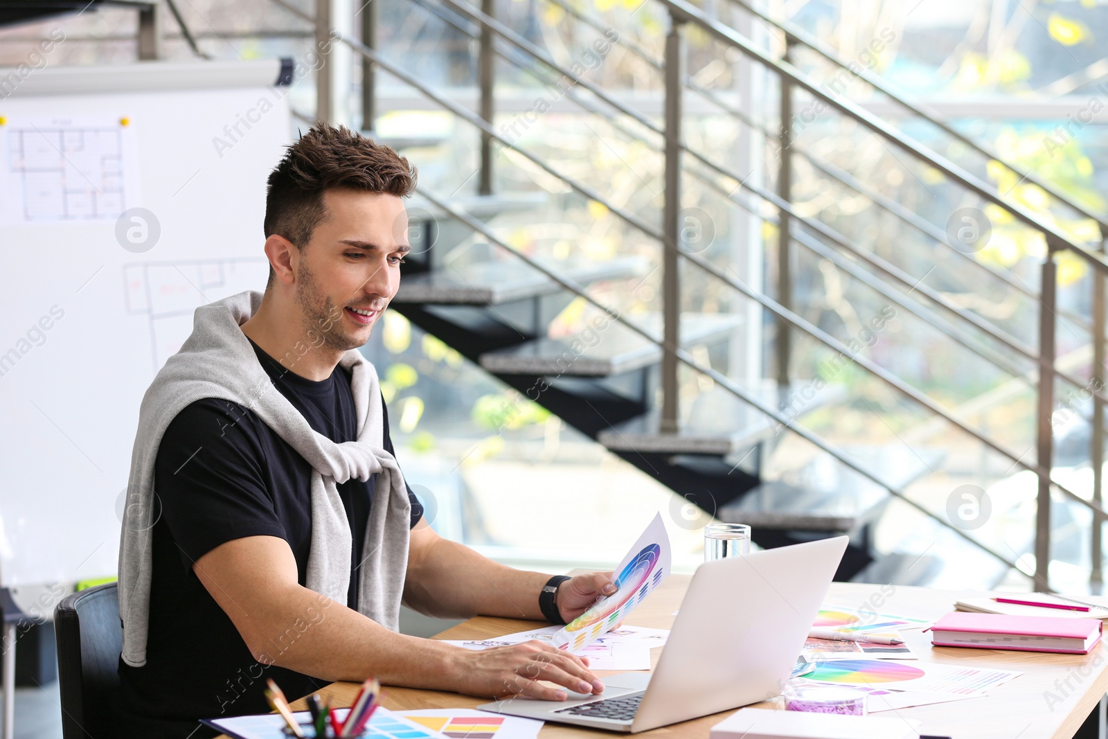 Photo of Professional interior designer at workplace in office