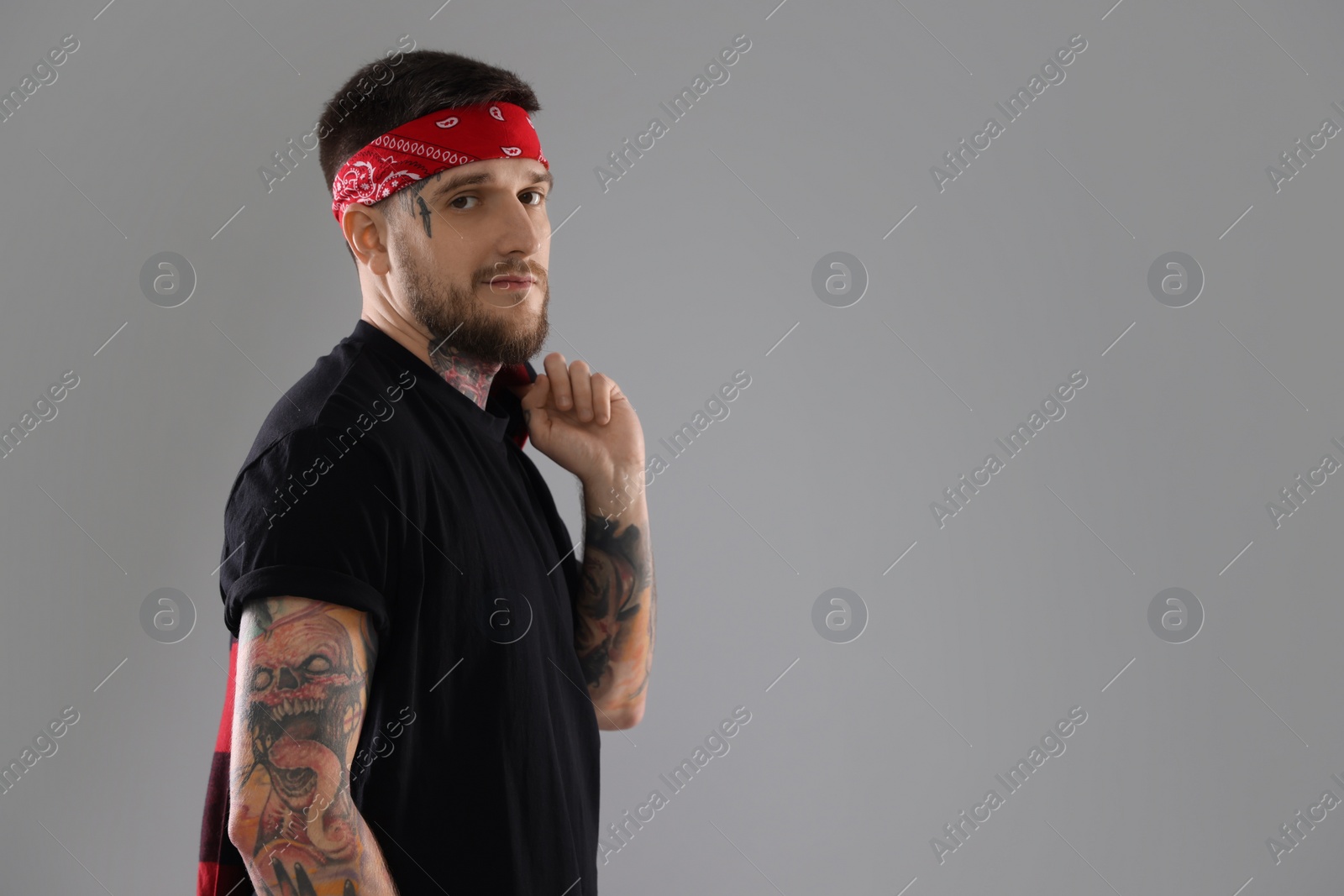 Photo of Portrait of handsome hipster man on light grey background. Space for text