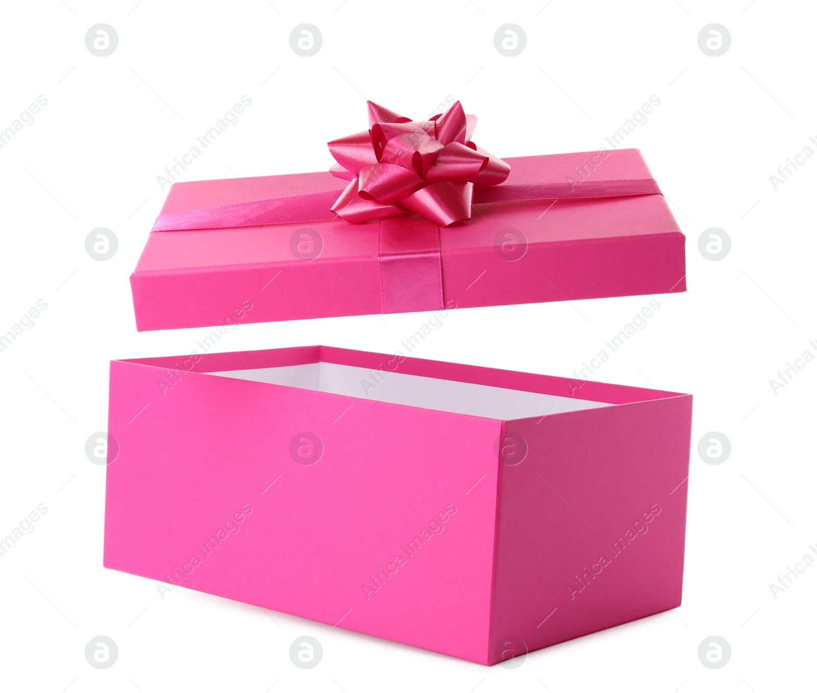 Photo of Pink gift box and lid with bow on white background