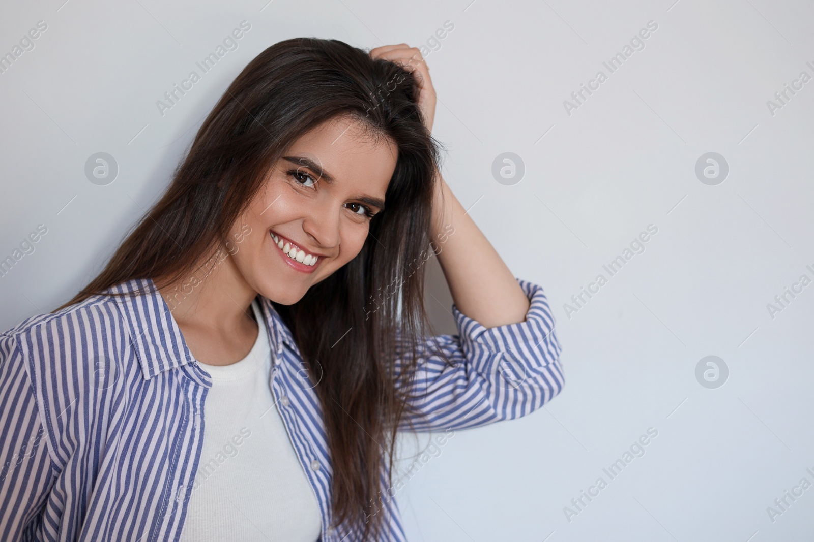 Photo of Portrait of beautiful young woman on white background, space for text