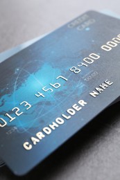 Many credit cards on grey table, closeup