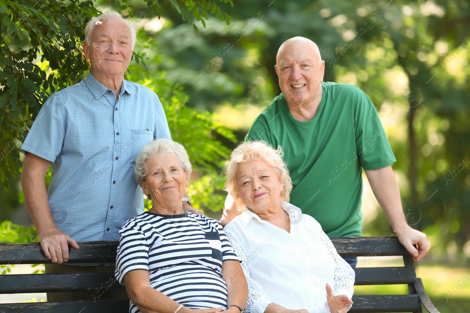 Photo of Elderly people spending time together in park
