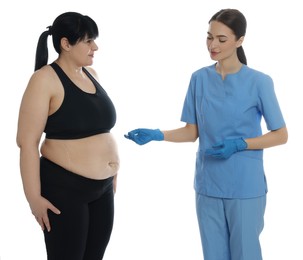 Photo of Doctor consulting obese woman on white background. Weight loss surgery