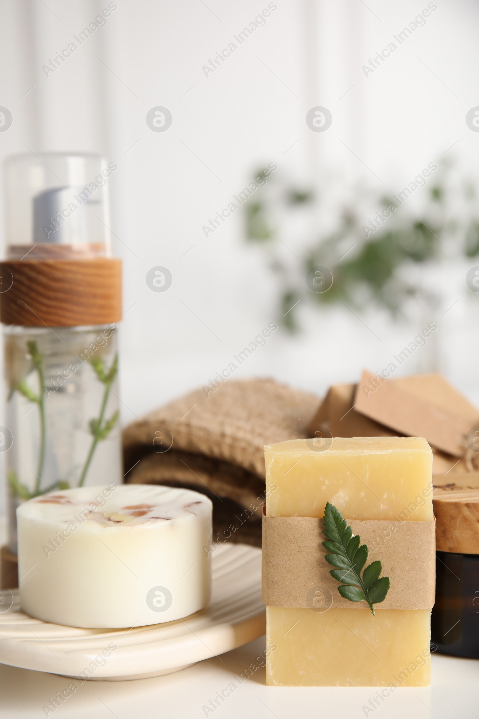 Photo of Eco friendly personal care products on white table indoors