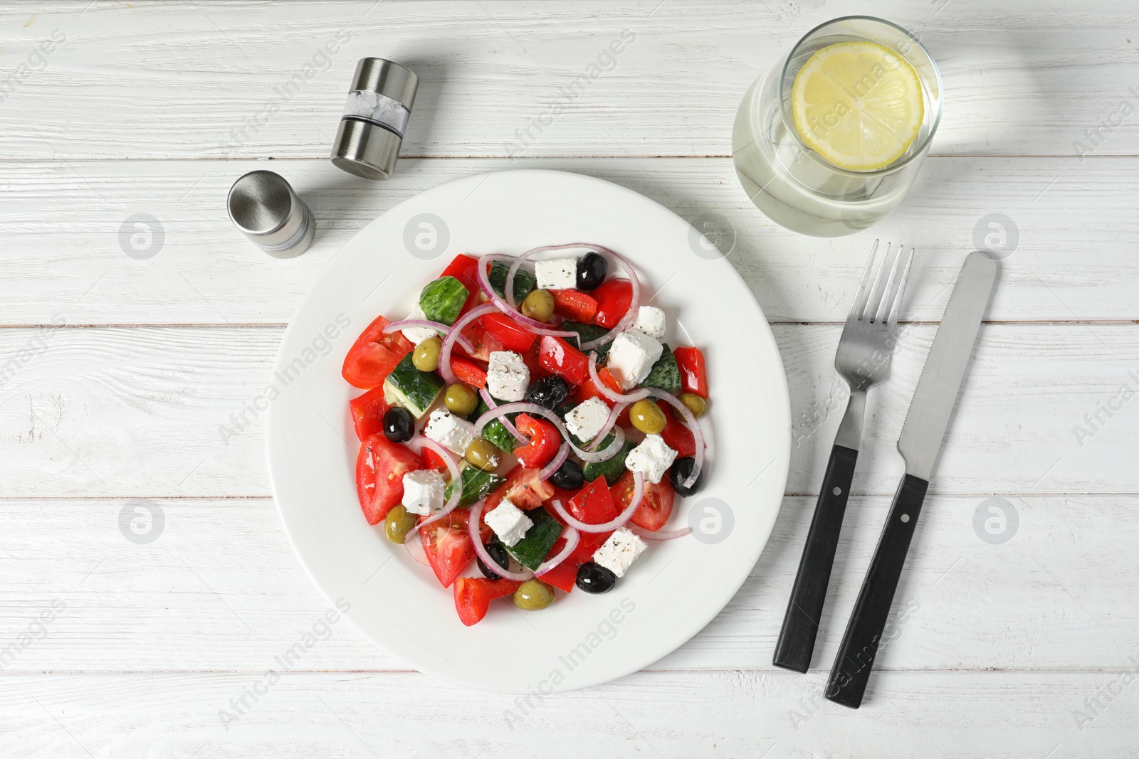 Photo of Plate with delicious salad on table, top view