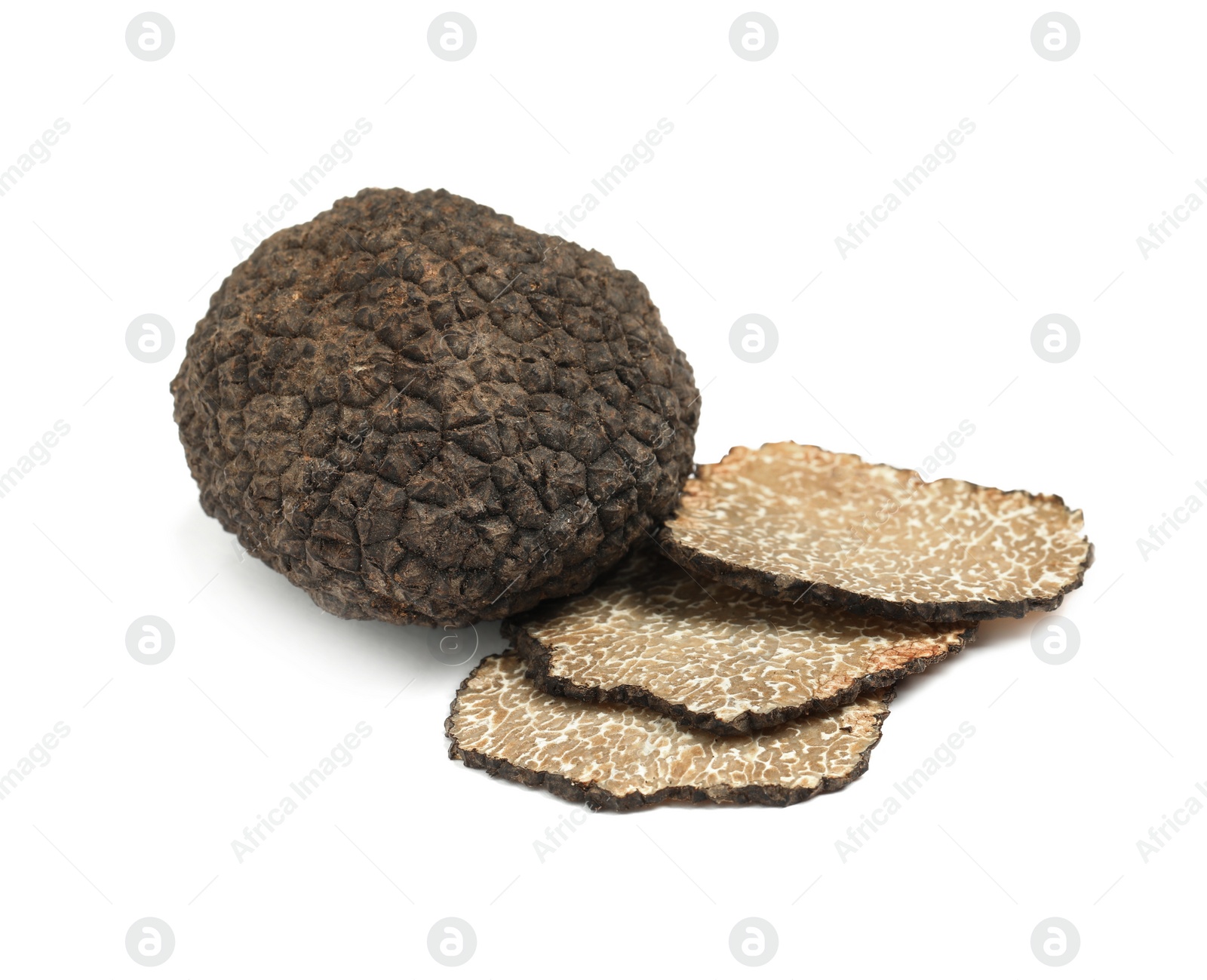 Photo of Cut and whole black truffles isolated on white