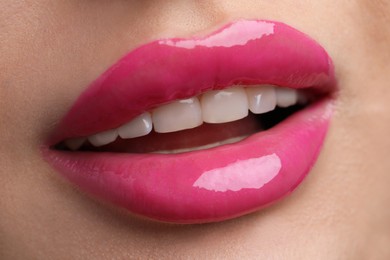 Photo of Young woman with perfect lips makeup, closeup
