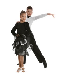 Photo of Beautifully dressed couple of kids dancing on white background