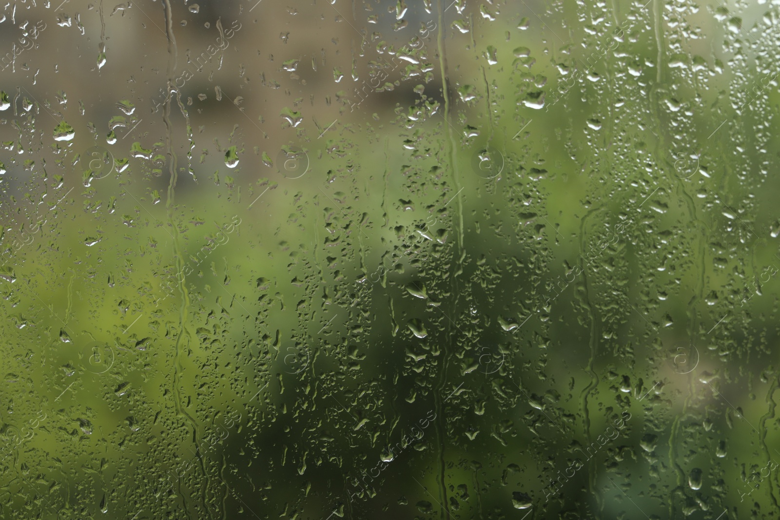 Photo of Window glass with raindrops as background, closeup