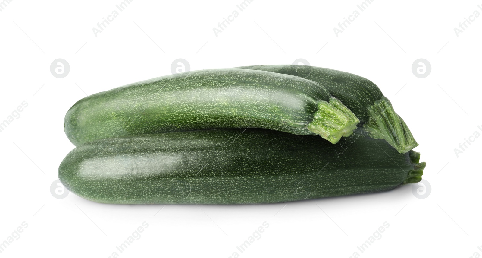 Photo of Raw green ripe zucchinis isolated on white