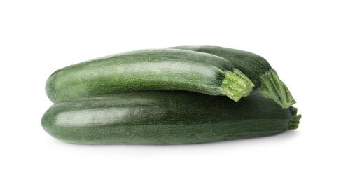 Photo of Raw green ripe zucchinis isolated on white