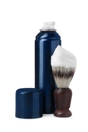 Photo of Bottle with shaving foam and brush on white background