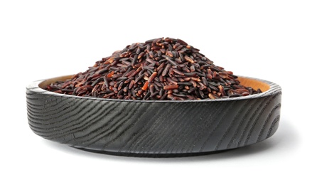 Photo of Plate with uncooked black rice on white background