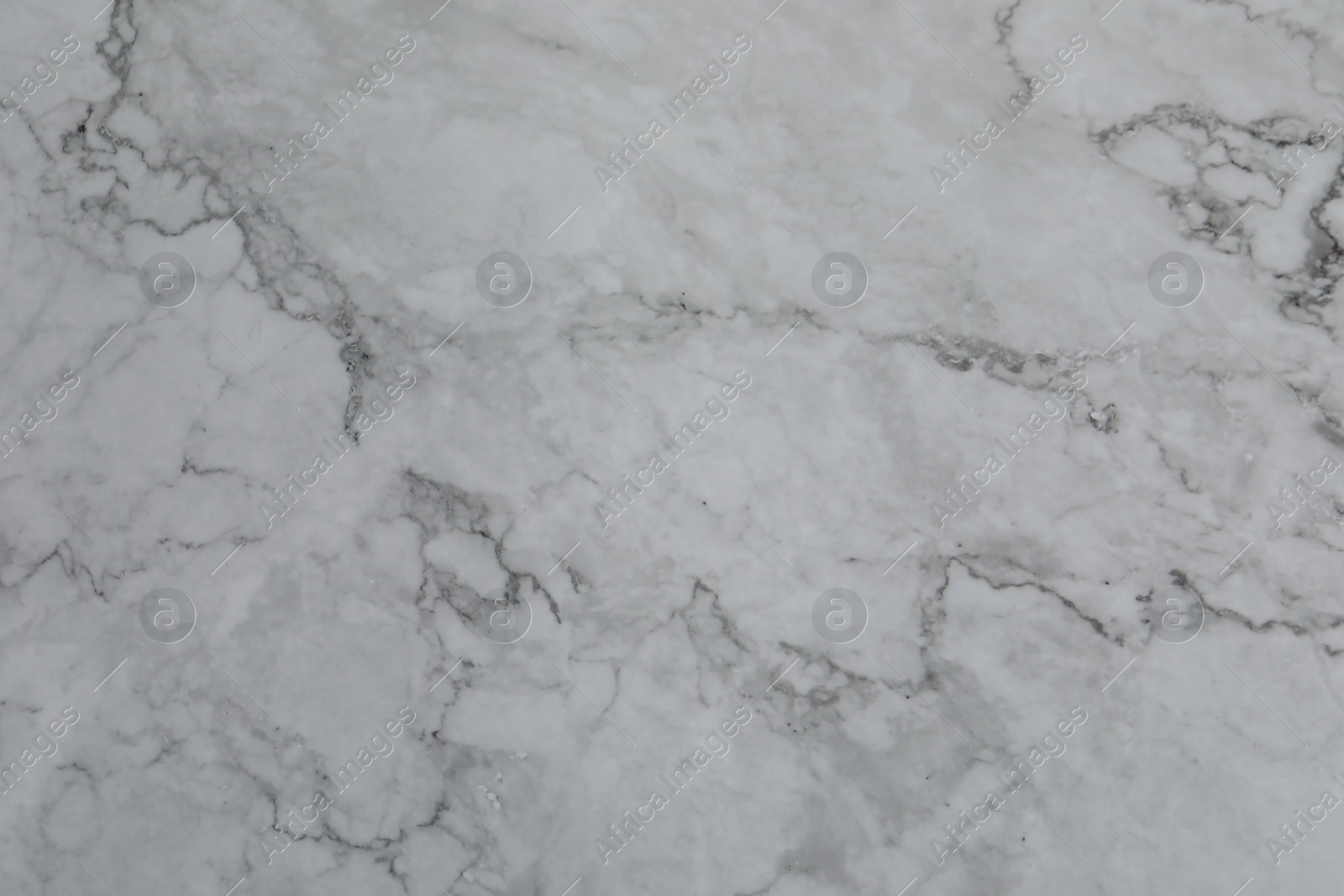 Photo of Texture of light grey marble surface as background, closeup