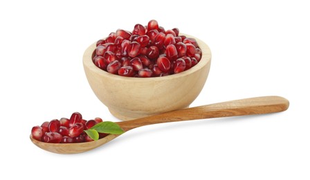Photo of Ripe juicy pomegranate grains, leaves in bowl and wooden spoon isolated on white