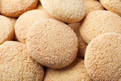 Tasty sugar cookies as background, closeup view