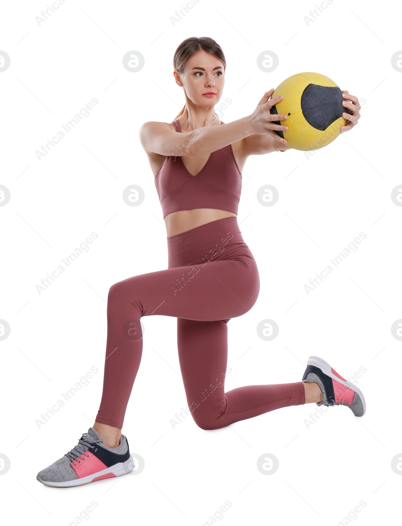 Photo of Athletic woman doing exercise with medicine ball isolated on white