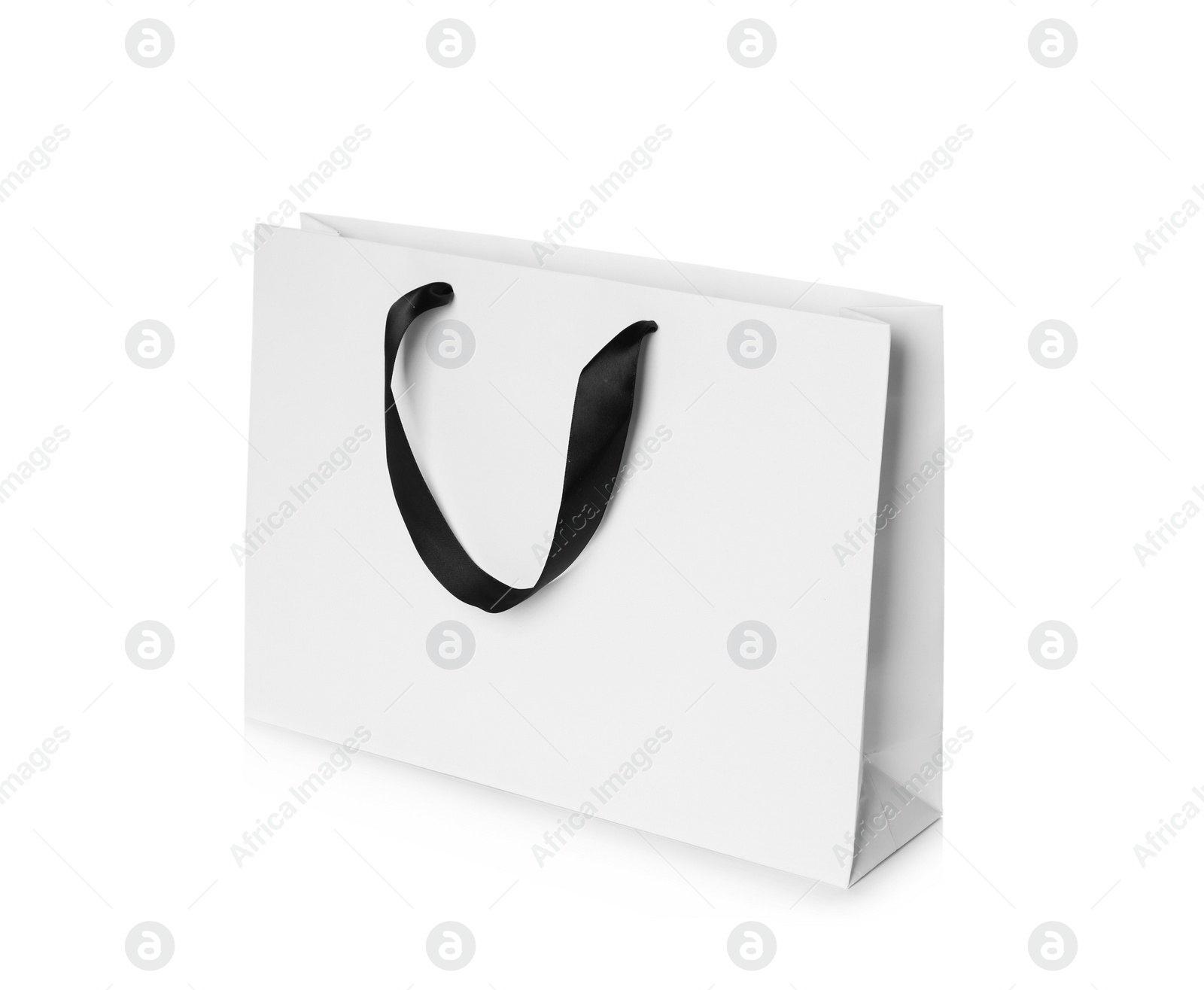 Photo of Paper shopping bag isolated on white. Mock up for design