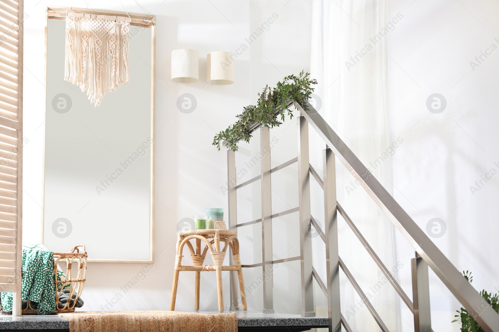 Photo of Stylish room decorated with beautiful eucalyptus garland