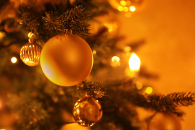 Photo of Closeup view of beautifully decorated Christmas tree indoors