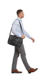Photo of Man with bag walking on white background