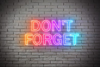 Image of Phrase Don't forget against brick background. Reminder