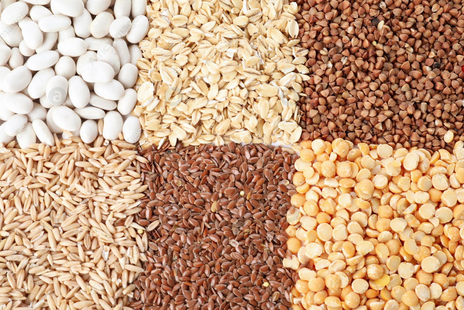 Photo of Different grains and cereals as background, top view