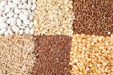 Different grains and cereals as background, top view