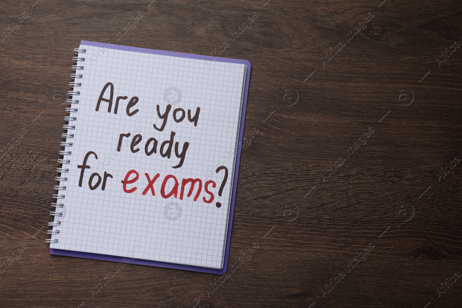 Photo of Notebook with question Are You Ready For Exams? on wooden table, top view. Space for text