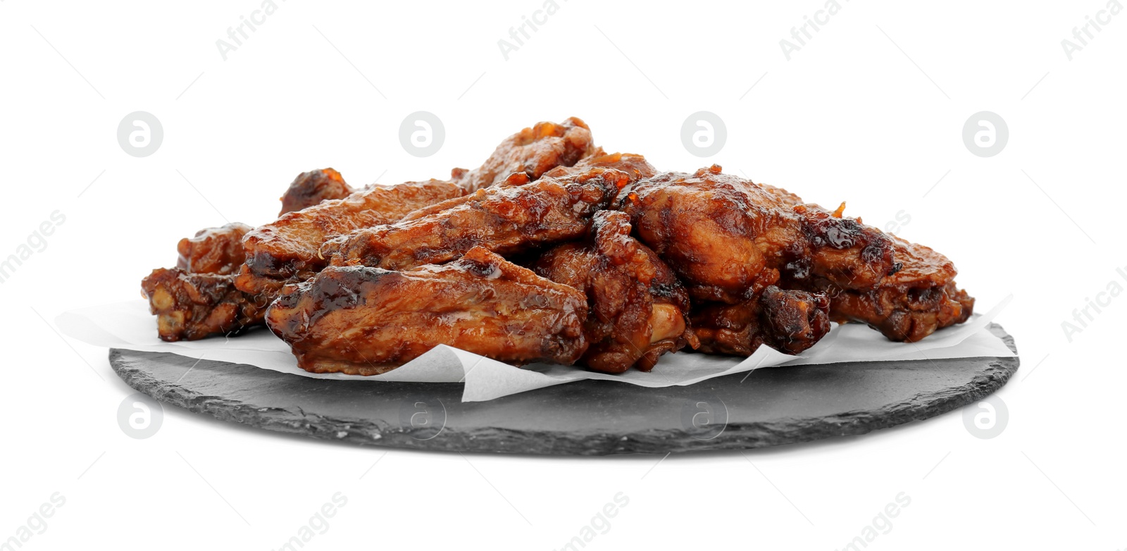 Photo of Slate board with delicious chicken wings isolated on white