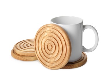 Photo of Mug and stylish wooden coasters on white background