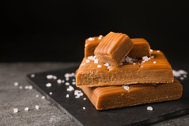 Salted caramel on light grey table, closeup view