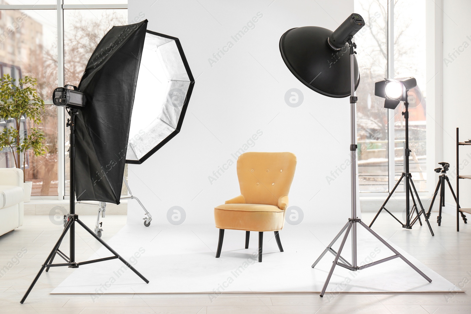 Photo of Armchair in photo studio with professional equipment