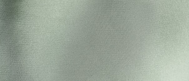 Photo of Texture of light green fabric as background, top view