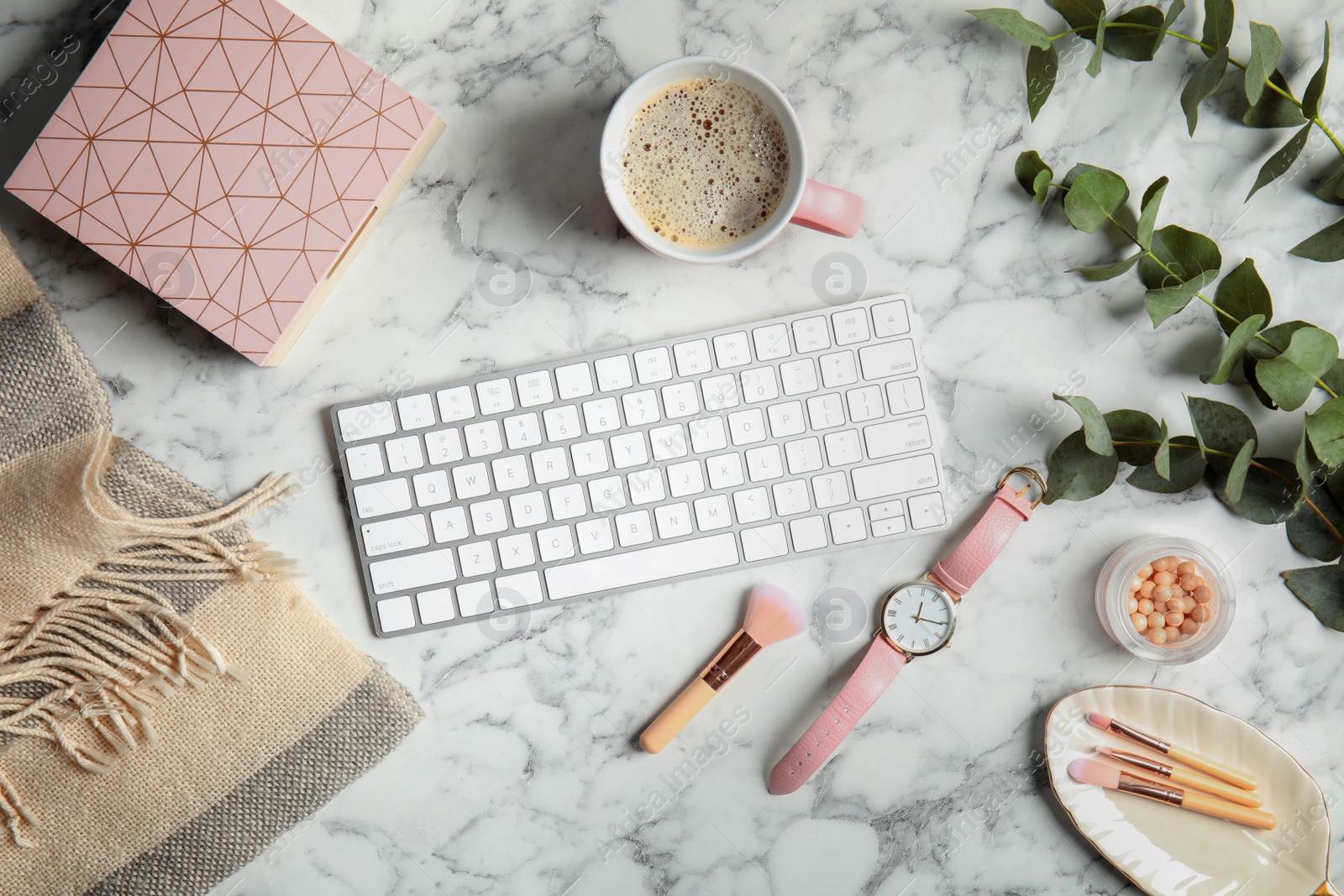 Photo of Flat lay composition with computer keyboard on marble table. Blogger's workplace