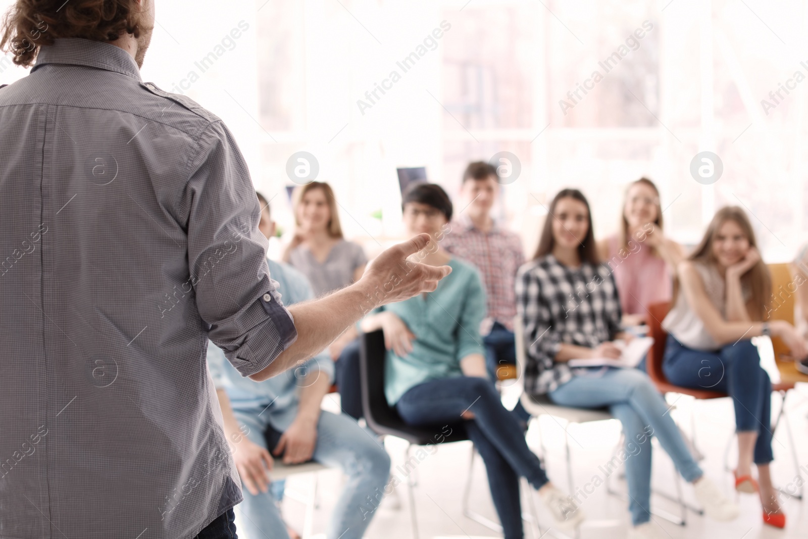 Photo of Young people having business training in office