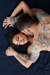 Passionate couple having sex on bed, top view