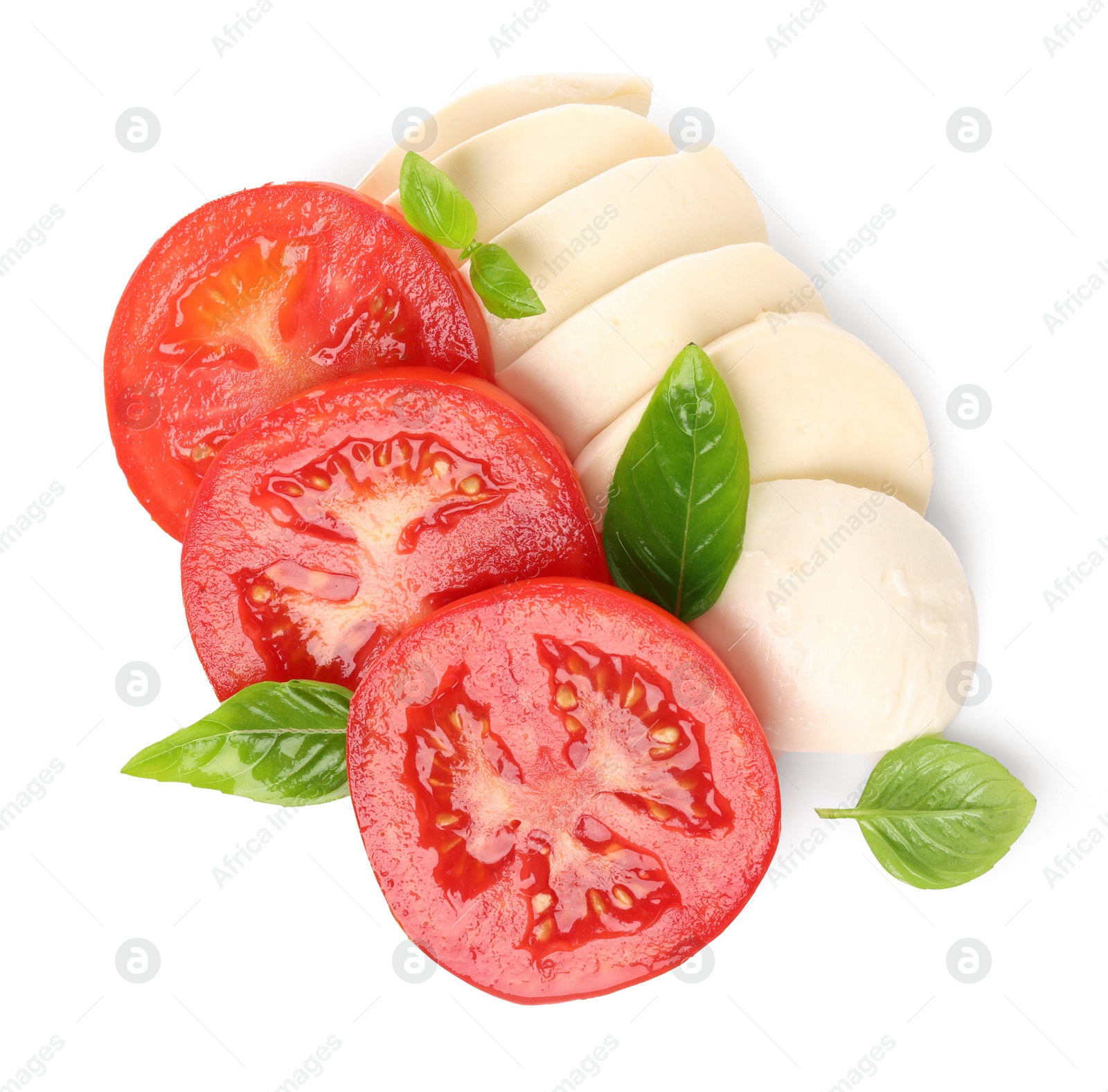 Photo of Delicious Caprese salad with tomatoes, mozzarella cheese and basil leaves isolated on white, top view