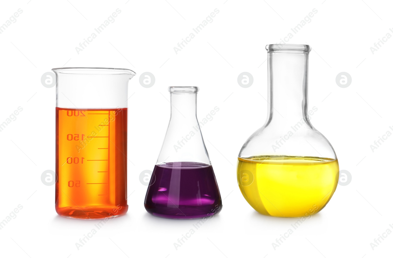 Photo of Laboratory glassware with color liquids on white background