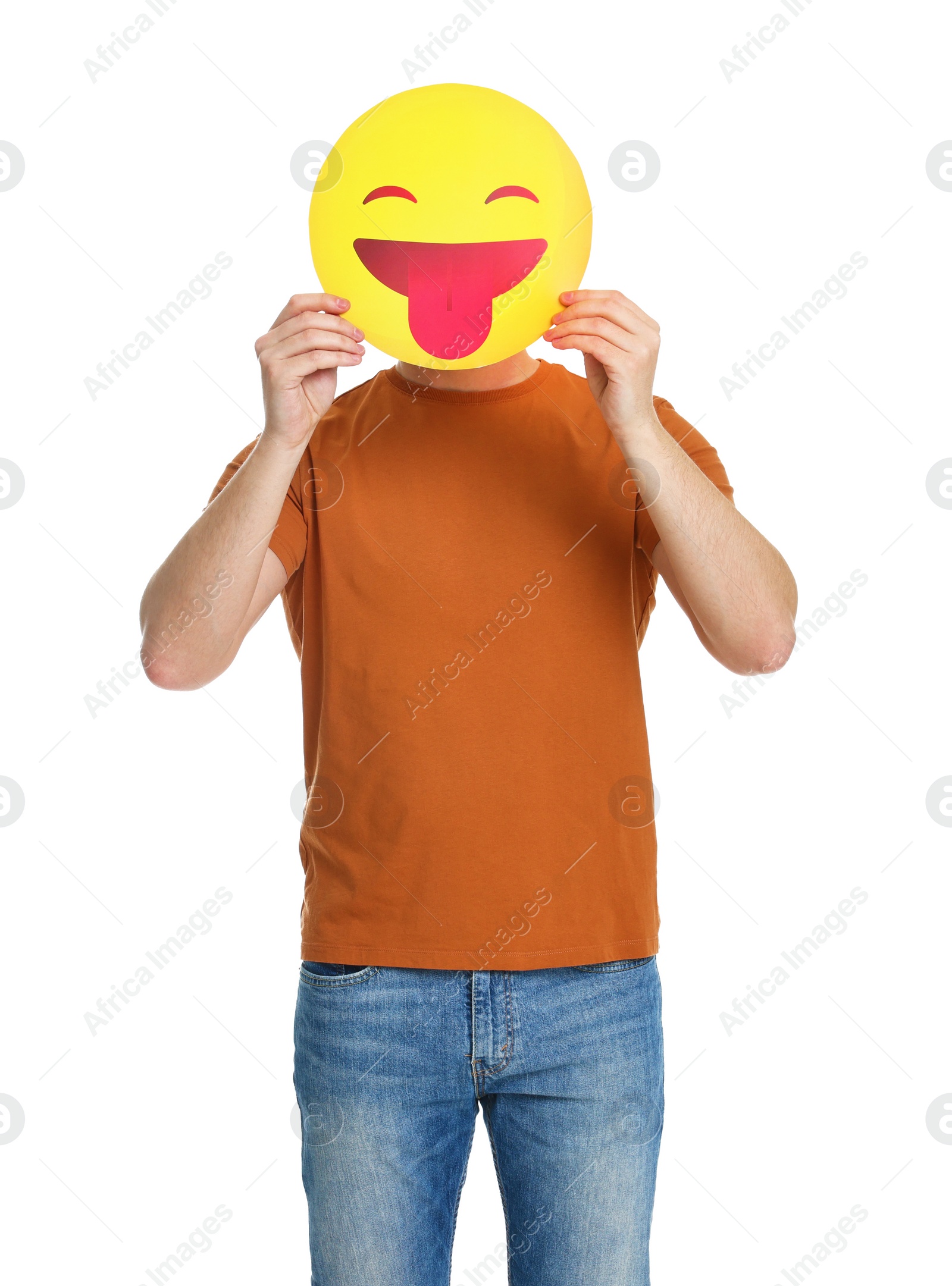 Photo of Man covering face with emoticon sticking out tongue on white background