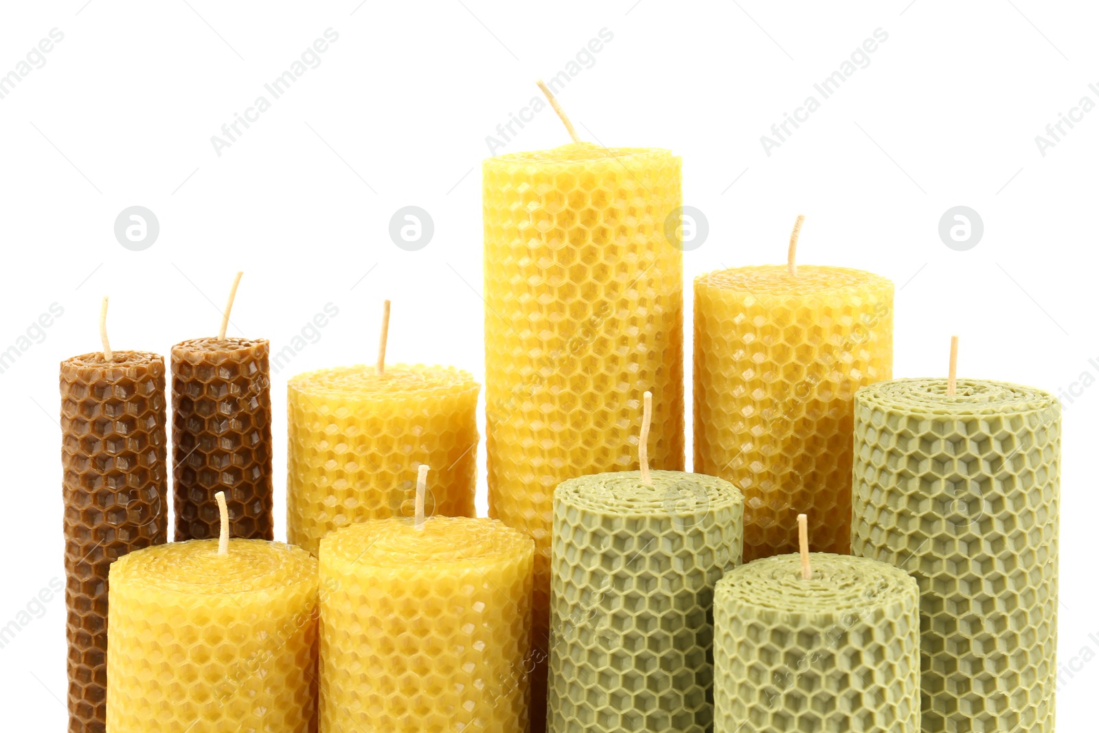 Photo of Stylish elegant beeswax candles isolated on white