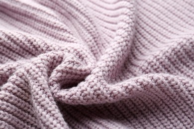 Beautiful violet knitted fabric as background, closeup