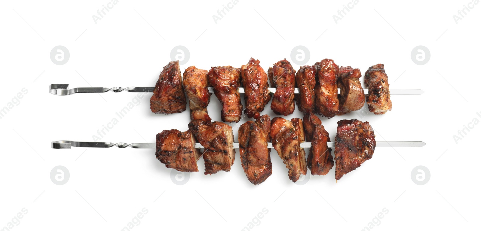 Photo of Metal skewers with delicious shish kebabs isolated on white, top view