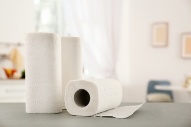 Rolls of paper towels on table in kitchen