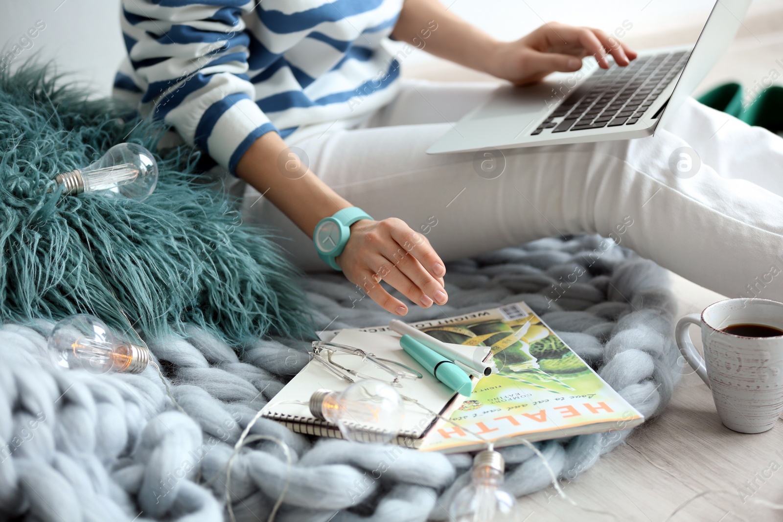 Photo of Female blogger with laptop indoors