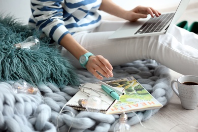 Female blogger with laptop indoors