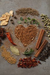 Flat lay composition of different spices on grey textured table